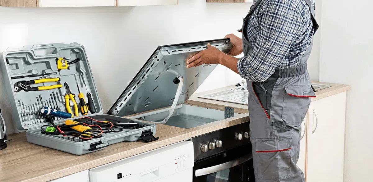 Handyman repairing a cooktop and checking wiring connections in Duluth, MN